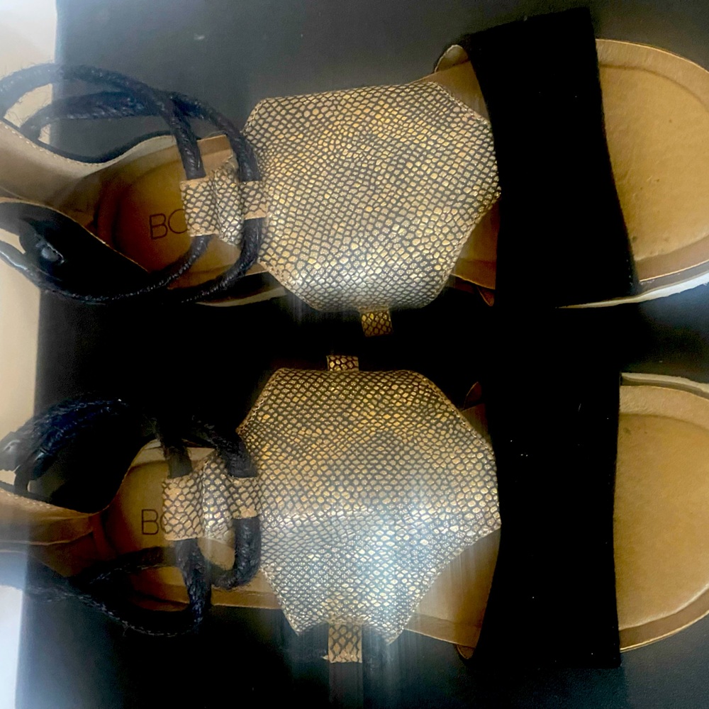 Boutique by Corkys black with center gold and black small wedge . Sandal size 8